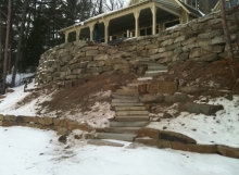 Beautiful natural outcropping stone retaining wall